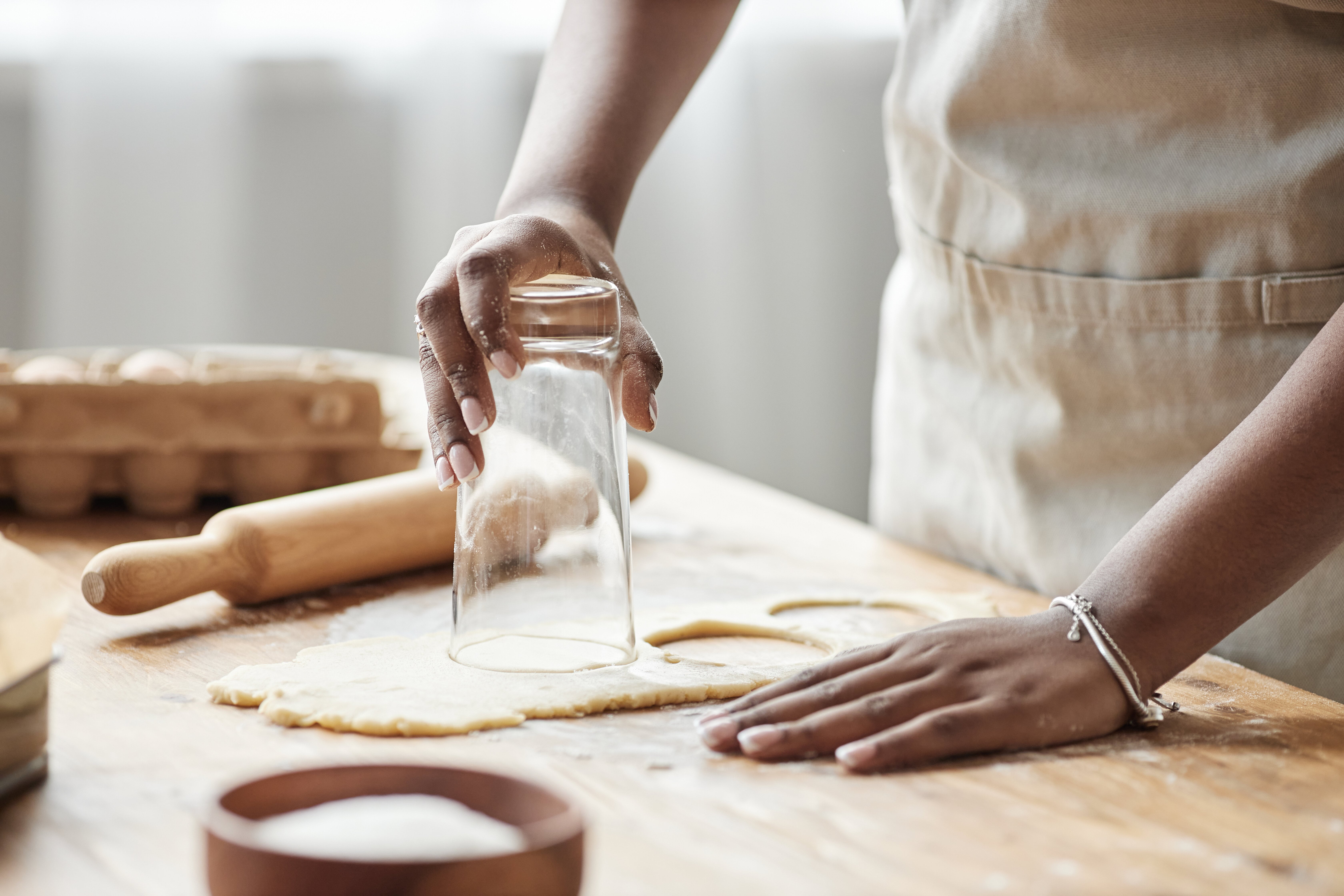 Baker cutting out dough